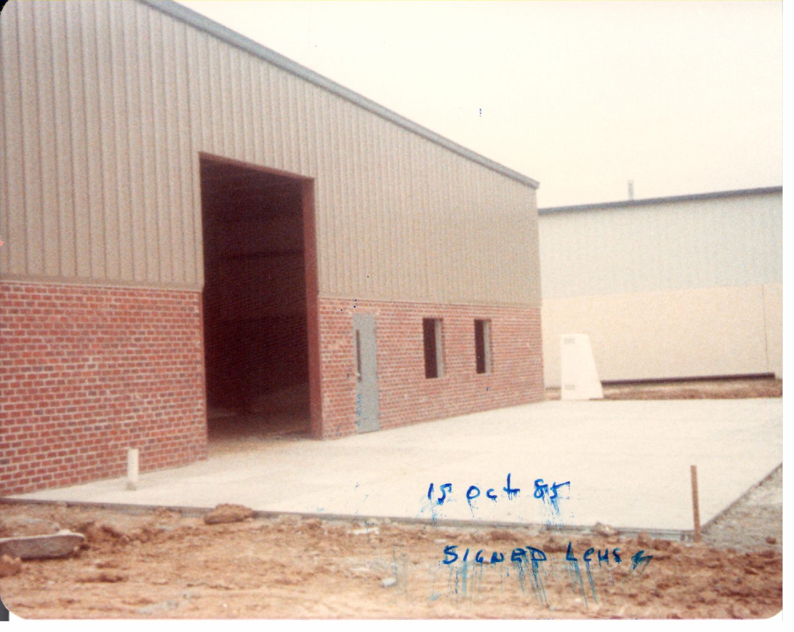The lease is signed. Red clay, fresh brick, no doors yet.
