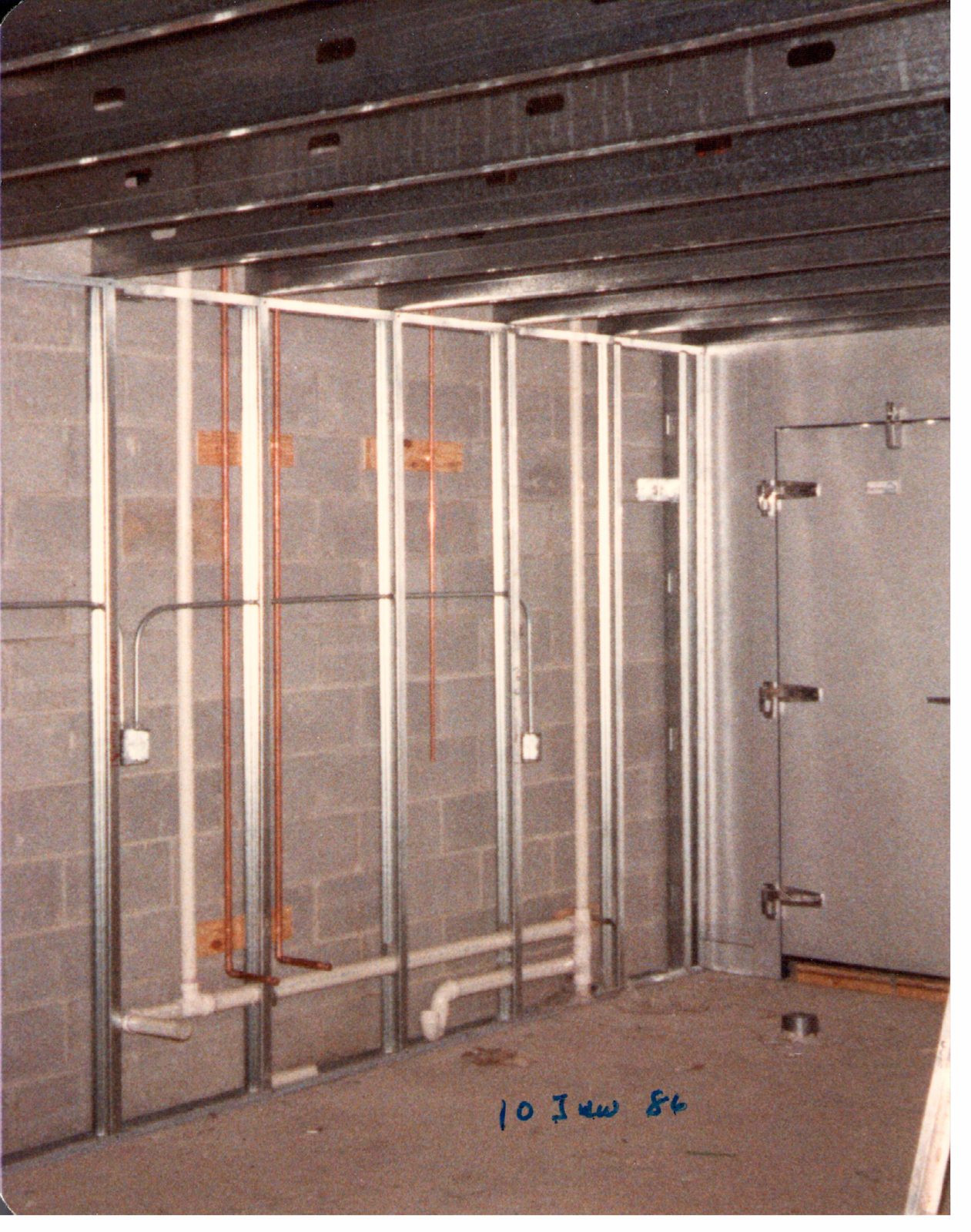 The first cooler walls go up.